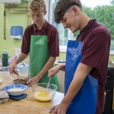 Two students cooking